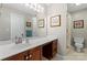Bright bathroom boasting a spacious vanity, ample lighting, and a shower with floral curtains at 308 Home Rd, Salisbury, NC 28147