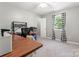Well-lit bedroom with a wooden desk and natural light at 308 Home Rd, Salisbury, NC 28147