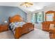 Stylish bedroom features a wooden bed frame and dresser at 308 Home Rd, Salisbury, NC 28147