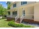 Charming two-story home with a covered porch, white railings, and brick accents at 308 Home Rd, Salisbury, NC 28147