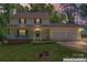 Charming two-story home with a cozy front porch and a well-maintained lawn at 308 Home Rd, Salisbury, NC 28147