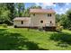 Large, grassy yard, perfect for outdoor activities, with a well-maintained back deck at 308 Home Rd, Salisbury, NC 28147