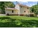 Expansive backyard featuring a spacious wooden deck, perfect for outdoor entertaining at 308 Home Rd, Salisbury, NC 28147