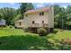 The home's rear exterior features a deck with a backyard surrounded by mature trees at 308 Home Rd, Salisbury, NC 28147