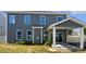 Backyard with gray siding, a covered patio, and lush green lawn at 3090 Bridgewater St, Lancaster, SC 29720