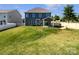 Large, fenced backyard with a covered patio, perfect for outdoor entertaining at 3090 Bridgewater St, Lancaster, SC 29720