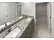 Well-lit bathroom with dual sinks and granite countertops at 3090 Bridgewater St, Lancaster, SC 29720