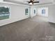 Spacious bedroom featuring neutral carpet, tray ceiling with fan, and bright natural light at 3090 Bridgewater St, Lancaster, SC 29720