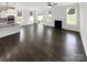 Spacious, open-concept living area featuring a fireplace and seamless flow into the kitchen at 3090 Bridgewater St, Lancaster, SC 29720
