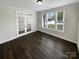 Office space featuring hardwood floors, French doors, and natural light from large windows at 3090 Bridgewater St, Lancaster, SC 29720