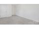 A spacious bedroom featuring neutral carpet and minimalist design with ample natural light at 4060 Beacon Ave # 148, Monroe, NC 28110