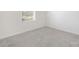 A well-lit bedroom with soft carpeting and natural light streaming through the window at 4060 Beacon Ave # 148, Monroe, NC 28110