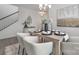 Elegant dining room featuring a contemporary chandelier, a dining table, and decorative art at 4060 Beacon Ave # 148, Monroe, NC 28110