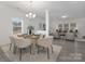 Open concept dining and living room, providing a spacious and inviting living space at 4060 Beacon Ave # 148, Monroe, NC 28110