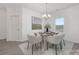 Bright dining room featuring a modern chandelier and a window with lots of natural light at 4060 Beacon Ave # 148, Monroe, NC 28110