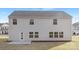 Exterior view of house with light gray siding and a back door leading to backyard at 4060 Beacon Ave # 148, Monroe, NC 28110
