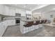 Bright kitchen with white cabinets, stainless appliances, and an island with seating at 4060 Beacon Ave # 148, Monroe, NC 28110
