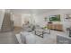 Bright living room boasts a staircase, stylish furniture, and a wall-mounted television at 4060 Beacon Ave # 148, Monroe, NC 28110