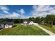 Expansive aerial view of a white farmhouse with a large yard and detached garage at 4282 Brandy Creek Ct, Clover, SC 29710