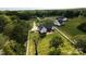 Aerial view of property with lush landscaping, fenced backyard, and circular driveway at 4282 Brandy Creek Ct, Clover, SC 29710
