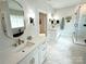 Elegant bathroom with dual vanities, stone countertops, gold fixtures and tiled walk-in shower at 4282 Brandy Creek Ct, Clover, SC 29710