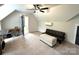 Spacious bedroom with plush carpet, ceiling fan, and a comfortable seating area at 4282 Brandy Creek Ct, Clover, SC 29710