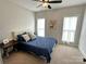 Cozy bedroom with a soft carpet, a bed, and two large windows at 4282 Brandy Creek Ct, Clover, SC 29710