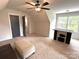 Inviting bedroom features plush carpet, a ceiling fan, and a convenient work or entertainment area at 4282 Brandy Creek Ct, Clover, SC 29710