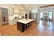 Bright kitchen features stainless appliances, large island, and hardwood floors at 4282 Brandy Creek Ct, Clover, SC 29710