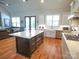 Spacious kitchen with stainless appliances, large island, hardwood floors, and white cabinets at 4282 Brandy Creek Ct, Clover, SC 29710