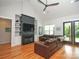 Cozy living room with fireplace, built-in shelving, leather sofas, and vaulted ceiling at 4282 Brandy Creek Ct, Clover, SC 29710