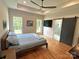Spacious bedroom with wood floors, ensuite bathroom access, and large windows for natural light at 4282 Brandy Creek Ct, Clover, SC 29710