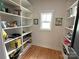 Walk-in pantry with organized shelving and hardwood floors at 4282 Brandy Creek Ct, Clover, SC 29710