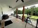 Charming covered porch with ceiling fans overlooking a well-maintained yard at 4282 Brandy Creek Ct, Clover, SC 29710