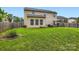 Spacious backyard with lush green grass and mature trees, perfect for outdoor activities at 5056 Crandon Rd, Fort Mill, SC 29707