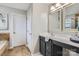 Bathroom boasts a large vanity with double mirrors, ample countertop space, and a private doorway at 5056 Crandon Rd, Fort Mill, SC 29707