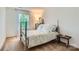 Charming bedroom with a wrought iron bed frame, soft carpet, and bright natural light at 5056 Crandon Rd, Fort Mill, SC 29707