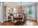 Elegant dining room featuring a large table, ornate chandelier, and a decorative china cabinet at 5056 Crandon Rd, Fort Mill, SC 29707