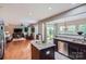 Open concept kitchen and living area with hardwood floors and modern appliances at 5056 Crandon Rd, Fort Mill, SC 29707