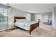 Spacious primary bedroom features a wood sleigh bed and an adjoining sitting room at 5056 Crandon Rd, Fort Mill, SC 29707