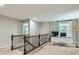 Second floor office space with decorative railing, white desk, plush carpet, and natural light at 5056 Crandon Rd, Fort Mill, SC 29707