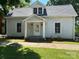 Charming home with covered entryway, neutral siding, and well-maintained lawn at 517 Western Ave, Statesville, NC 28677