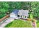 Aerial view of a single-Gathering house with a fenced yard, and lush trees at 5179 Poplar Glen Dr, Matthews, NC 28104