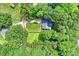 Aerial shot of property lines featuring a secluded property surrounded by mature trees with a well-manicured lawn at 5179 Poplar Glen Dr, Matthews, NC 28104