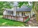 Lovely back deck with outdoor seating, string lights, and a grill, perfect for entertaining or enjoying the outdoors at 5179 Poplar Glen Dr, Matthews, NC 28104