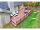 Aerial view of the back deck, showcasing ample seating, a grill, and easy access from the house at 5179 Poplar Glen Dr, Matthews, NC 28104