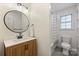 Updated bathroom featuring modern fixtures, stylish vanity, and shower-tub combo at 5179 Poplar Glen Dr, Matthews, NC 28104