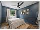Bedroom with natural light, a ceiling fan and tasteful wall decor at 5179 Poplar Glen Dr, Matthews, NC 28104