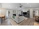 Bright living room featuring a vaulted ceiling, fireplace, large TV, and comfortable seating at 5179 Poplar Glen Dr, Matthews, NC 28104