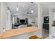Bright living room with high ceilings, modern lighting, fireplace, and a cozy seating area at 5179 Poplar Glen Dr, Matthews, NC 28104